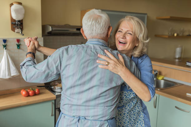 istock Elderly Couple Enjoying in Dance While Cooking at Home. 1308579518