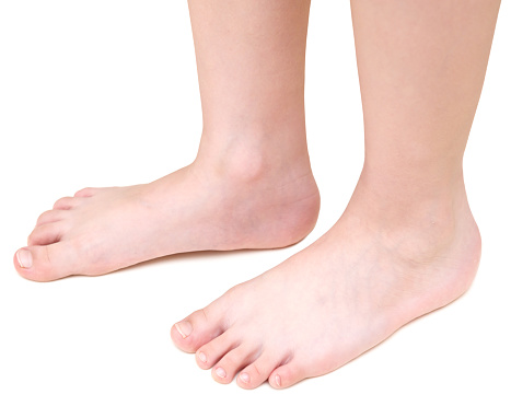 child's feet on a white background