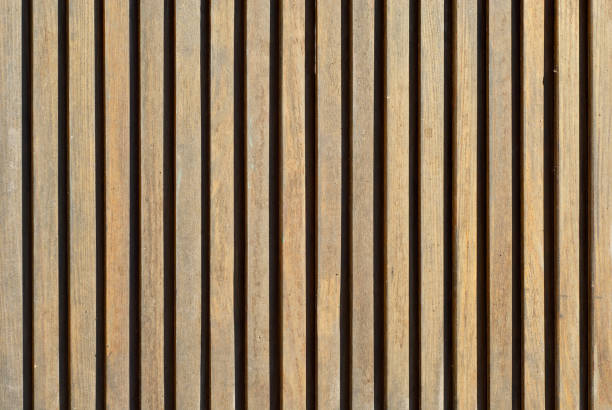 istock Wall texture with striped paneling. Wood paneling close up. 1308582121