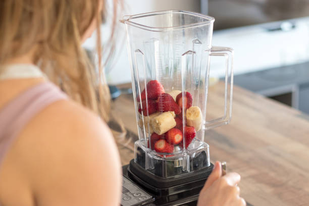 istock Strawberries and banana in a blender 1308583445