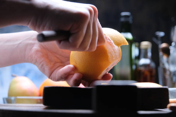 istock Preparing fresh fruit salad with grapefruit, pear and kiwi 1308584801