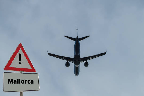 istock Sign Mallorca with Plane on Sky 1308585553