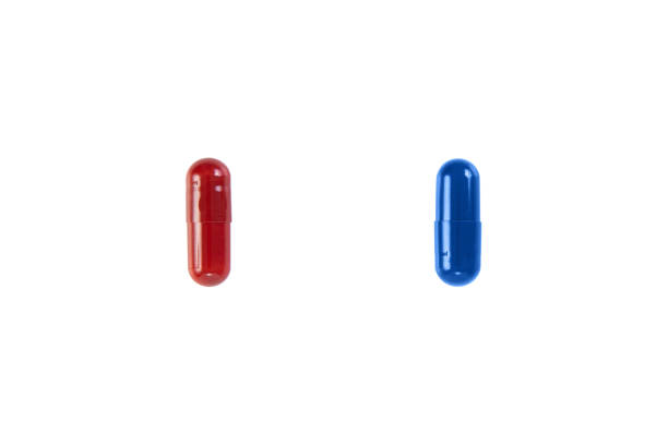 close up of red and blue pills isolated on white background. clipping path. - antibiotic red medicine healthcare and medicine imagens e fotografias de stock