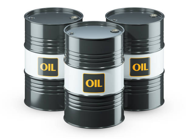 istock Three black oil barrels isolated on white background 1308586300
