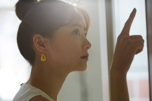 istock A young Asian business woman thinks seriously 1308588655