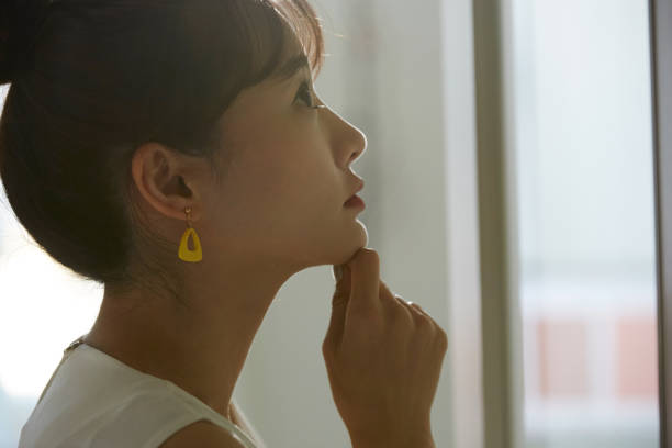 istock A young Asian business woman thinks seriously 1308588709
