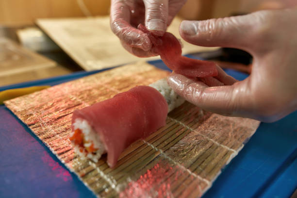 istock Man preparing sushi in a japan restaurant 1308589005