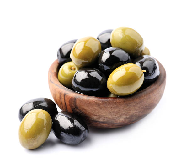 istock Sweet olives on wooden plate 1308589054
