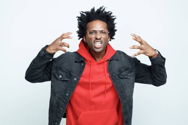 istock Angry man in red hoodie 1308589735