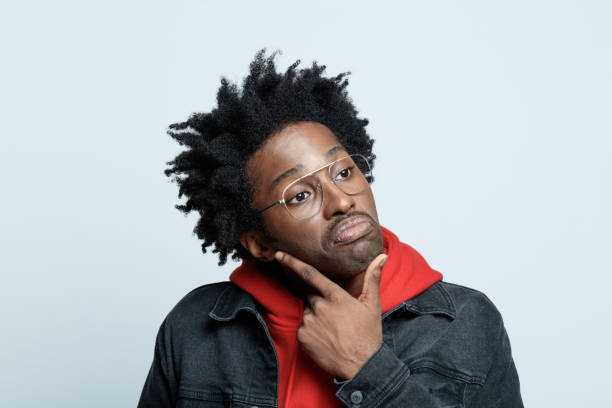 istock Confused man in red hoodie 1308591068