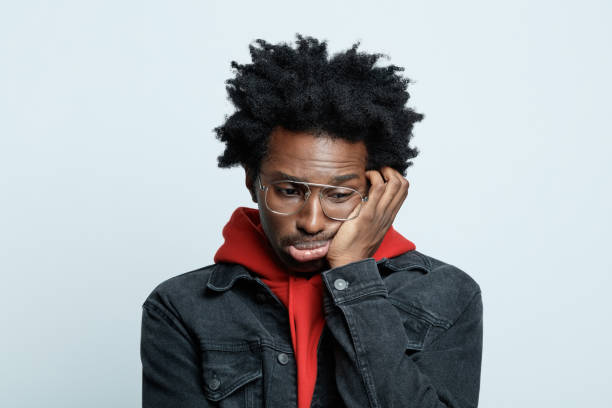istock Worried man in red hoodie 1308592955