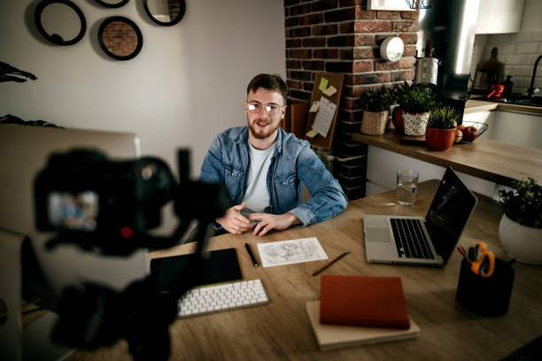 istock Cameraman recording with his equipment 1308594244