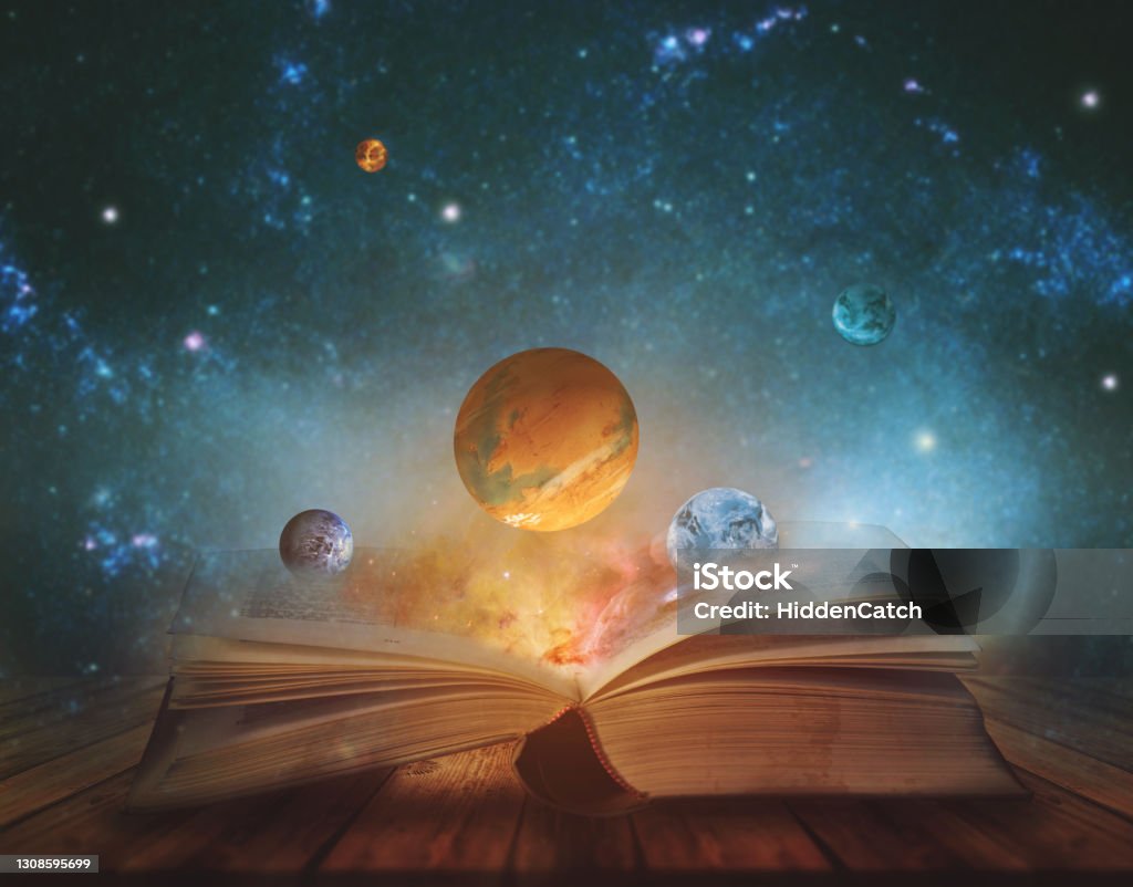Book of the universe - opened magic book with planets and galaxies. Elements of this image furnished by NASA Outer Space Stock Photo