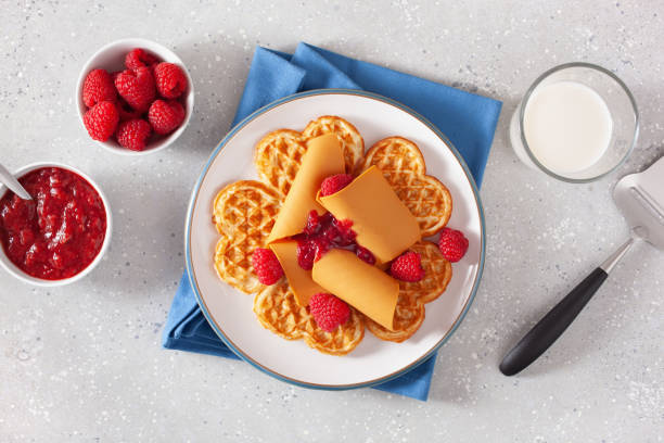 istock waffles with Norwegian brunost traditional brown cheese and raspberry jam 1308597099