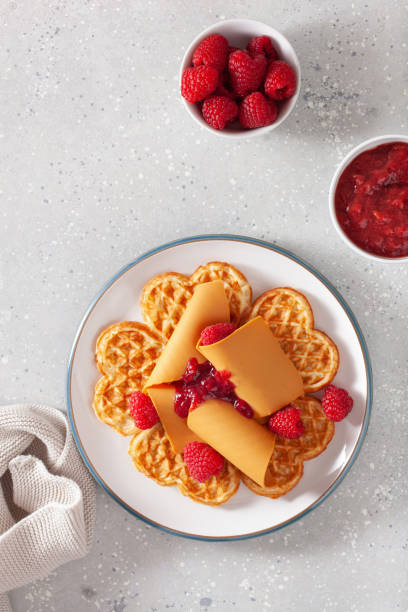 istock waffles with Norwegian brunost traditional brown cheese and raspberry jam 1308597150