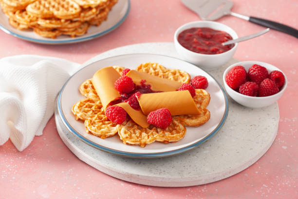 istock waffles with Norwegian brunost traditional brown cheese and raspberry jam 1308597225