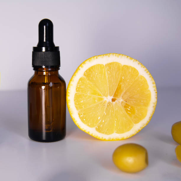 istock Serum bottle, lemon and olives on white background 1308597251