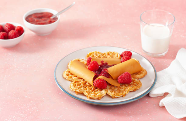 istock waffles with Norwegian brunost traditional brown cheese and raspberry jam 1308597324