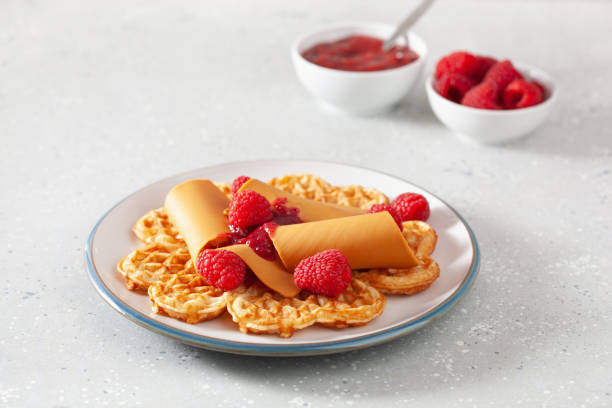 istock waffles with Norwegian brunost traditional brown cheese and raspberry jam 1308597333