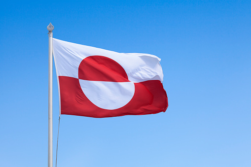 the flag of Denmark against blue sky