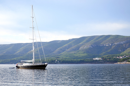 Beautiful sailing yacht anchored in Vrboska bay, Hvar Island, Croatia
