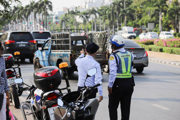 BMTA Special Patrols facilitate traffic. Bangkok, THAILAND - March 20, 2021: BMTA Special Patrols facilitate traffic after traffic police close road around protests area. riot police stock pictures, royalty-free photos & images