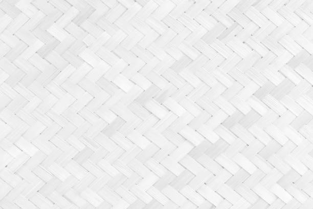istock White bamboo weaving pattern, old woven rattan mat texture for background and design art work. 1308599929