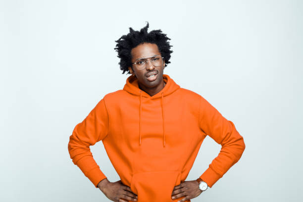 istock Disappointed man in orange hoodie 1308600233