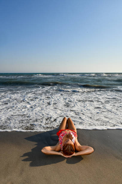 istock Woman having fun on the beach. 1308601632
