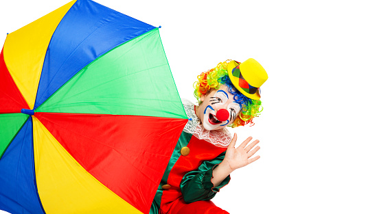 children in colorful clown outfits, isolated on a white background