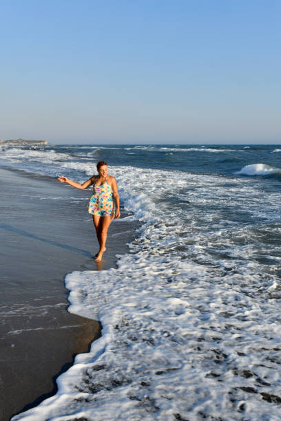 istock Woman having fun on the beach. 1308603205
