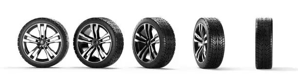 Photo of Five car wheels on a white background. 3D rendering illustration.