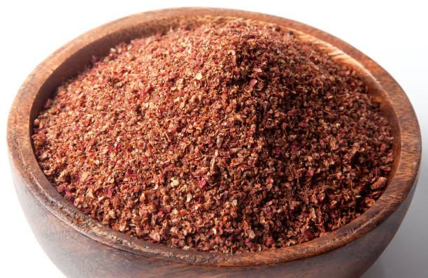 Powder sumac dried in bowl.On white background Powder sumac dried in bowl.On white background sumac stock pictures, royalty-free photos & images