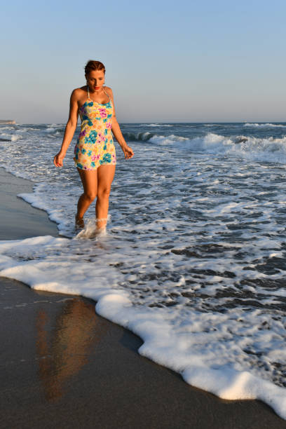 istock Woman having fun on the beach. 1308606163
