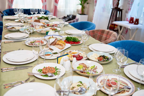 istock Table set with white plates, napkins , cutlery and wineglasses on table, copy space. Place setting at wedding reception. Table served for banquet in restaurant 1308607097