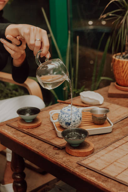 istock Woman serving Chinese tea in a tea ceremony 1308607629