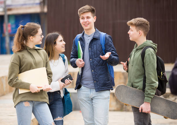 istock Teenagers have fun talking on street 1308608973