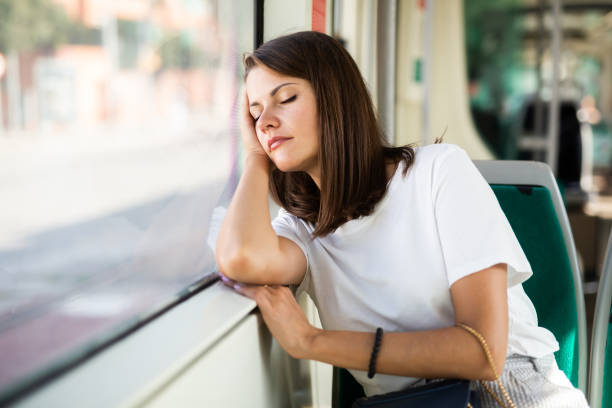 istock Woman sleeping in modern streetcar 1308608995