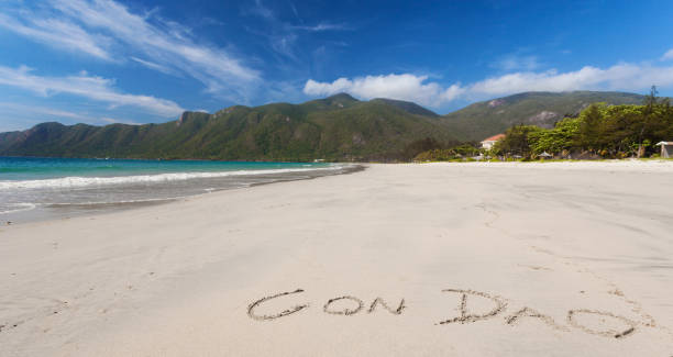 istock Calm Tropical Beach With Inscription Con Dao Written On A Sand 1308609311