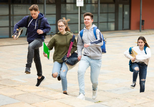 istock Teenager school kids running 1308615073