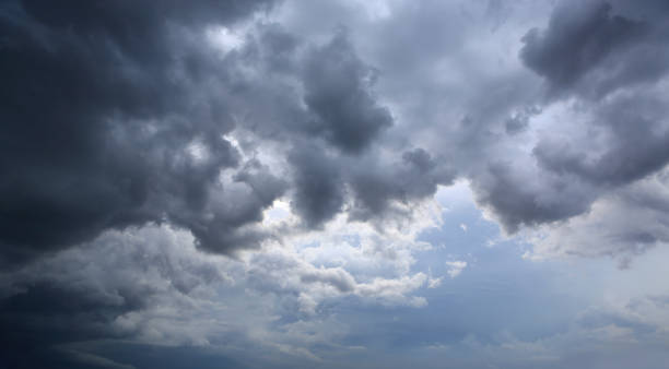 istock dark storm clouds on sky at evening background 1308615797