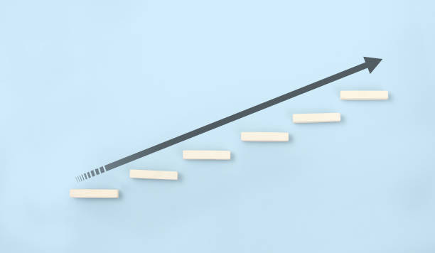istock Block stacking as step stair in hand. Business concept 1308615960