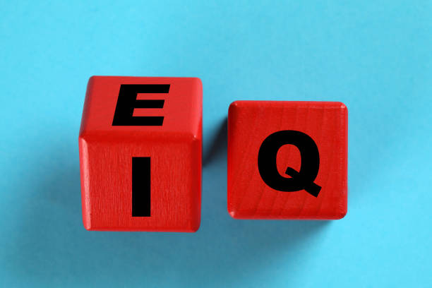 istock Red cubes with letters E, I and Q on light blue background, flat lay 1308616103