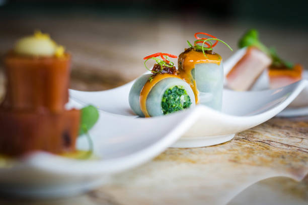 istock Cold appetiser platter: Pea Starch Noodle Rolls Filled Vegetable with Sesame Sauce and Xo Chili Sauce. 1308616175