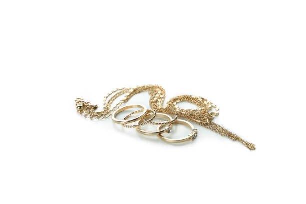 istock Golden rings and chain isolated on white background 1308616239