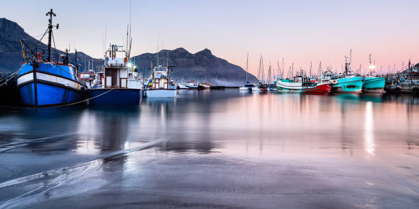 Long exposure of Hout Bay harbor at dawn stock photo