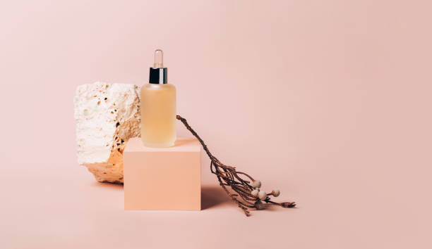 istock Bottle cosmetic product abstract podium pink background 1308617399