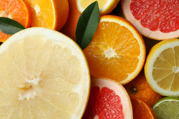istock Ripe citrus slices on whole background, close up 1308617781
