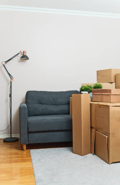 istock Cardboard boxes in room. Real estate and moving concept. 1308618057