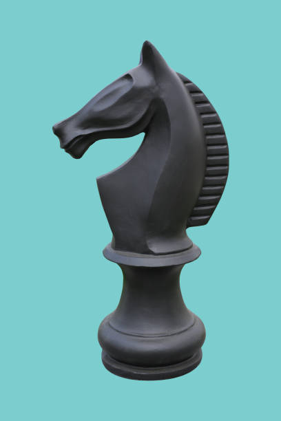 istock Black horse chess isolated on cyan background - clipping path 1308618130
